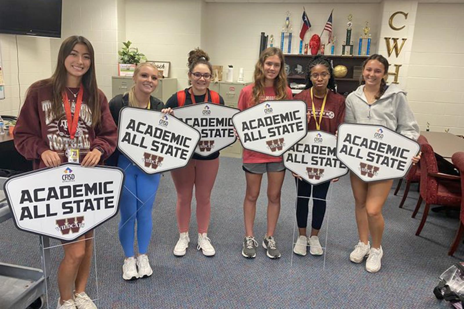Six Cypress Woods seniors pose for a photo recognizing them being named to the THSCA Academic All-State Team.